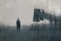 A bleak, moody, winters day of a male figure standing next to quarry machinery in a field in the countryside. With a blurred,