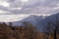 a bleak view of the mountains in cloudy weather