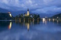 Bled lake and pilgrimage church at twilight reflected in water Royalty Free Stock Photo