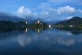 Bled lake and pilgrimage church at twilight reflected in water Royalty Free Stock Photo