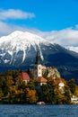 Bled lake with snow on the mountains in autumn Royalty Free Stock Photo