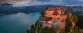 Bled, Slovenia - Aerial panoramic view of illuminated Bled Castle Blejski Grad with Pilgrimage Church of the Assumption of Maria