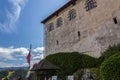 Walls of an old castle on the shore of Lake Bled in Slovenia against the sky Royalty Free Stock Photo