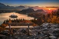 Bled, Slovenia - Hilltop bench and warm golden autumn sunrise at Lake Bled with Bled Island, autumn foliage and Julian Alps Royalty Free Stock Photo