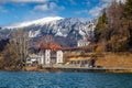 Bled, Slovenia - Lovely hotel at Lake Bled with Julian Alps at background on a sunny winter day with blue sky Royalty Free Stock Photo