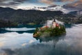 Bled, Slovenia - Magical foggy morning at Lake Bled Blejsko Jezero with the Pilgrimage Church of the Assumption of Maria