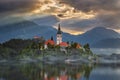 Bled, Slovenia - Misty sunrise at Lake Bled Blejsko Jezero with the Pilgrimage Church of the Assumption of Maria Royalty Free Stock Photo