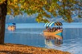 BLED, SLOVENIA - October 9, 2018: People tourists sliding on still waters in boats