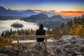 Bled, Slovenia - Runner woman relaxing and enjoying the beautiful autumn view and the colorful sunrise