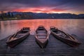 Bled, Slovenia - Traditional boats at Lake Bled with beautiful dramatic sunset