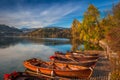 Bled, Slovenia - Traditional Slovenian boats by Lake Bled with colorful autumn trees
