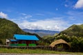 a blend of modern houses and traditional house fences in the Baliem Valley, Papua, Indonesia