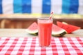 blend of watermelon detox juice on red tablecloth