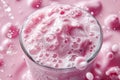 Blended berry drink, raspberry milkshake with bubbles close-up