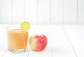 Blended fresh apple juice smoothie and honey bee and lemon.Beverage healthy the taste in glass on white wooden