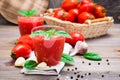 Blended fresh tomato juice with basil leaves in glasses