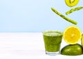 Blended Green smoothie with avocado, kiwi, asparagus and lemon on blue background. Healthy Eating. Diet Food. Copy Space Royalty Free Stock Photo