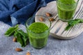 Blended Green Smoothie with green apple, spinach, kiwi and almond nuts