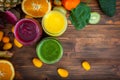 Blended green, yellow and purple smoothie with ingredients