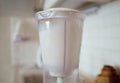 Blender and almonds soaked in water. Homemade healthy vegan milk Royalty Free Stock Photo