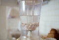 Blender and almonds soaked in water. Homemade healthy vegan milk Royalty Free Stock Photo