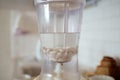 Blender and almonds soaked in water. Homemade healthy vegan milk Royalty Free Stock Photo