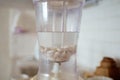 Blender and almonds soaked in water. Homemade healthy vegan milk Royalty Free Stock Photo