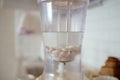 Blender and almonds soaked in water. Homemade healthy vegan milk Royalty Free Stock Photo