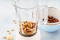 Blender and almonds soaked in water. Making vegan milk Royalty Free Stock Photo