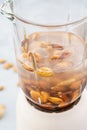 Blender and almonds soaked in water. Making vegan milk Royalty Free Stock Photo