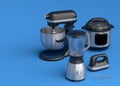 Blender for making healthy smoothie, hand mixer and multi cooker on blue