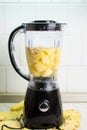 Blender ready for making pineapple banana smoothie