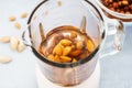 Blender with soaked almonds for making nut milk Royalty Free Stock Photo