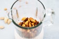 Blender with soaked almonds for making nut milk Royalty Free Stock Photo