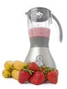 Blender with strawberries and bananas Royalty Free Stock Photo