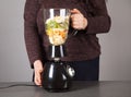 Blender, woman, fruits and gray background Royalty Free Stock Photo