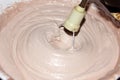 Blending whipping cream and cacao with blender