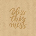 Bless this mess - hand drawn lettering phrase isolated on the cardboard grunge background. Fun brush ink inscription for