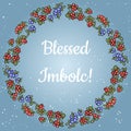 Blessed Imbolc text in a wreath of red and blue berries. Vector card template