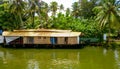 Scenic Houseboat on the backwaters during monsoon in Alleppey, Kerala, India.