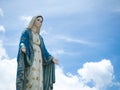 The Blessed Virgin Mary Statue blue sky background. Royalty Free Stock Photo