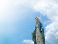 The Blessed Virgin Mary Statue blue sky background