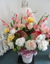 Blessed virgin Mary statue with bouquet of flowers