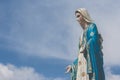 The Blessed Virgin Mary statue standing in front of The Cathedral of the Immaculate Conception.