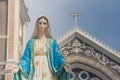 The Blessed Virgin Mary statue standing in front of The Cathedral of the Immaculate Conception at The Roman Catholic Diocese.