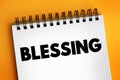 Blessing is the impartation of something with grace, holiness or spiritual redemption, text concept on notepad