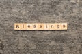 Blessings word written on wood block. Blessings text on cement table for your desing, Top view concept Royalty Free Stock Photo