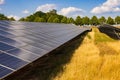View along many photovoltaic solar panels in a solar park Royalty Free Stock Photo