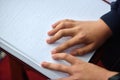 Blind child read book written in Braille Royalty Free Stock Photo