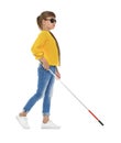 Blind girl with long cane walking on white